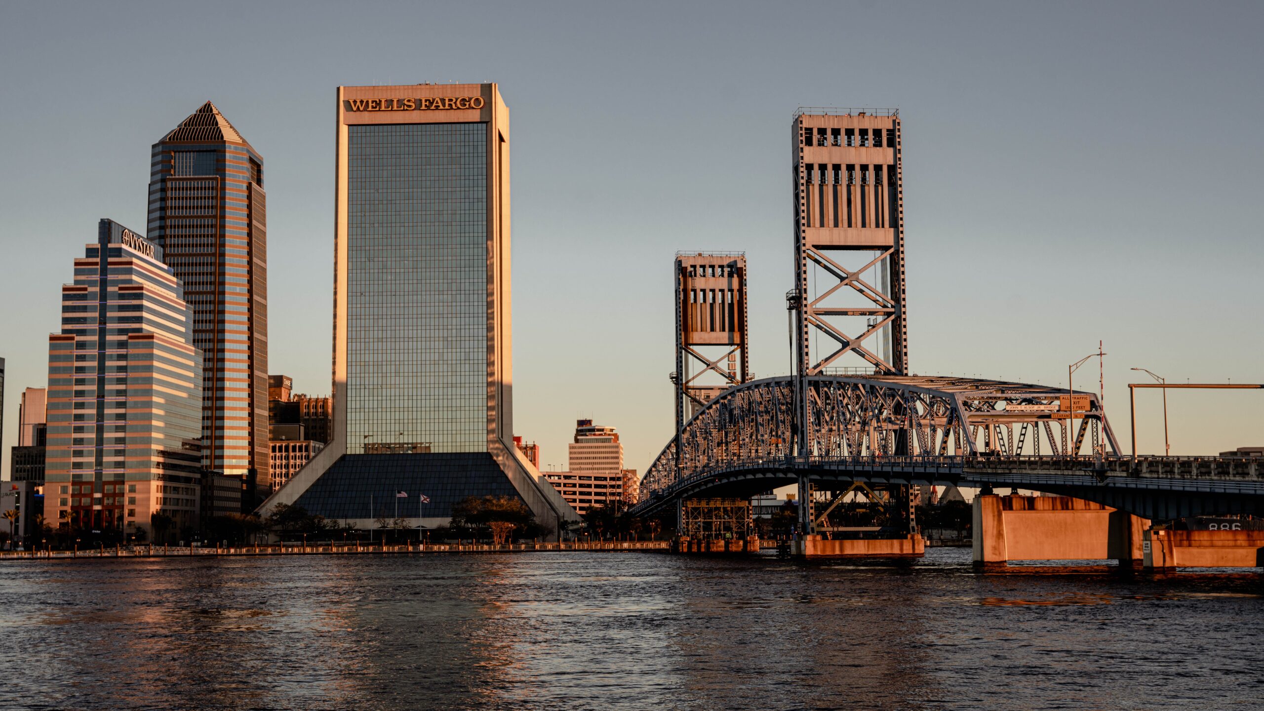 Jacksonville skyline at sunset across the St. Johns River