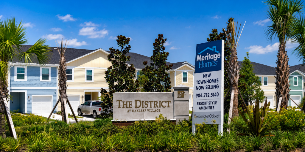 The District at Oakleaf by Meritage Homes townhomes and community entrance
